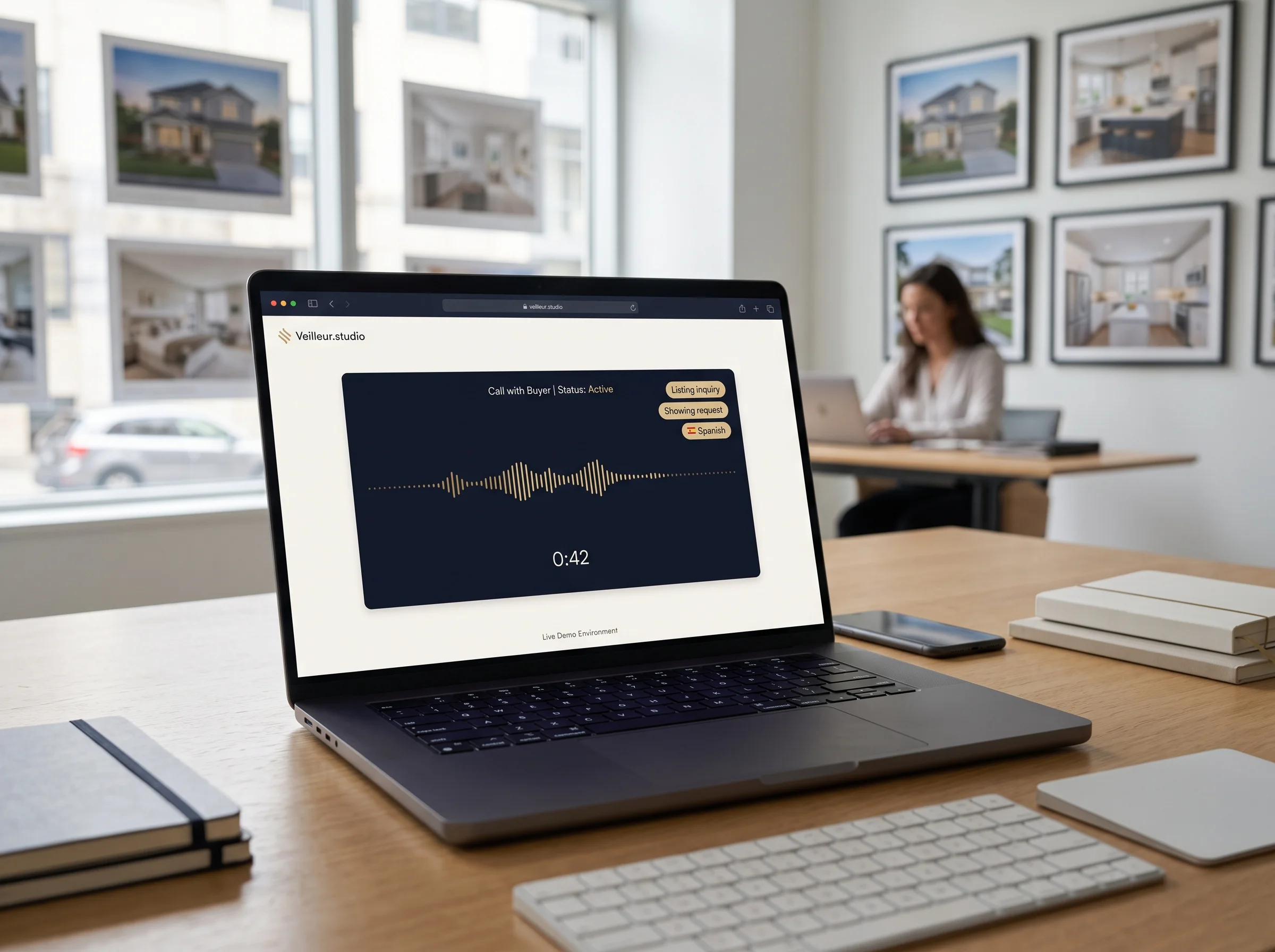 Browser-based Veilleur.studio voice demo running on a real estate office laptop.